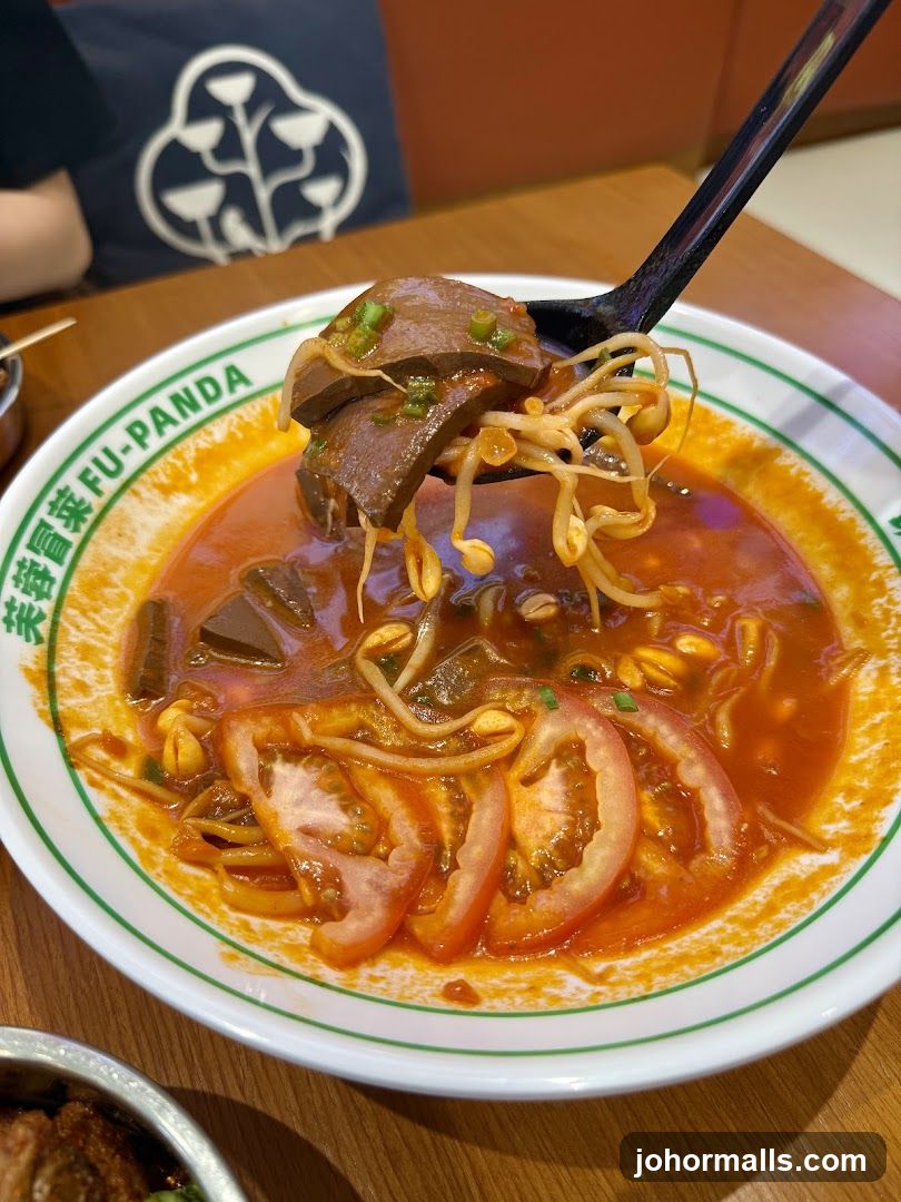 Spicy Noodle Soup with Blood Curd and Sprouts