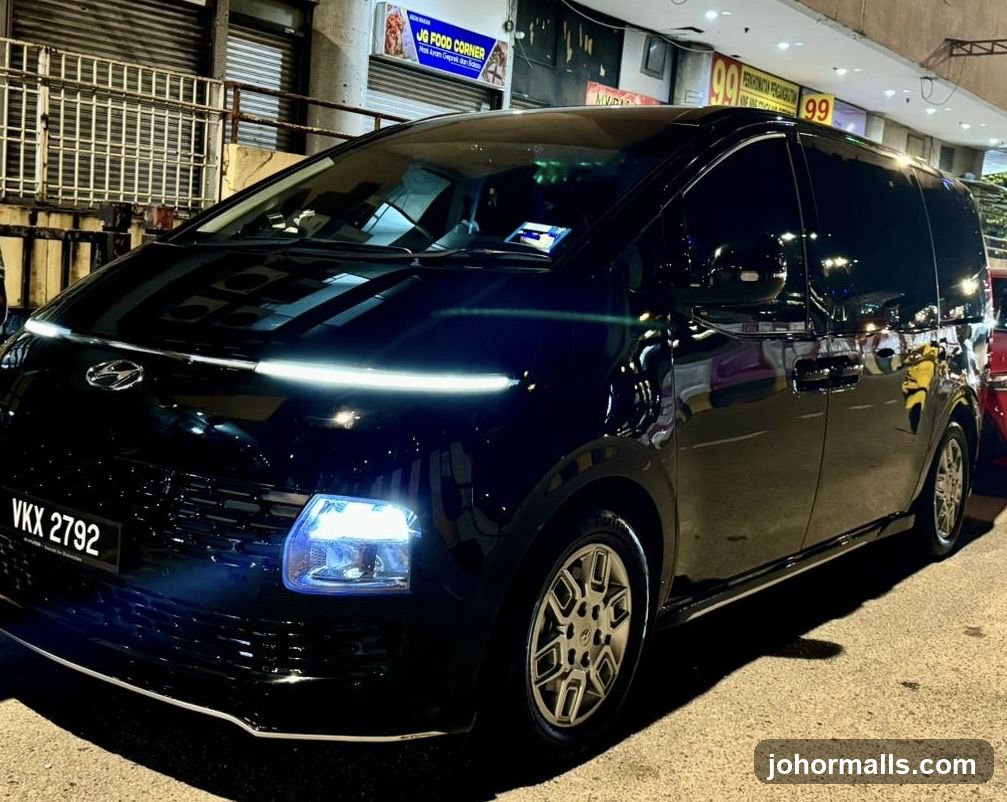 Black MPV parked at night