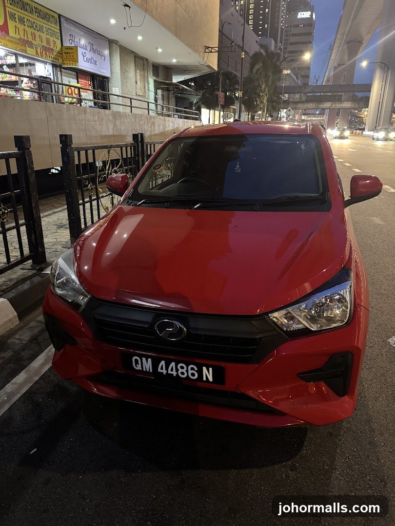 Red Car Parked Outside Shops