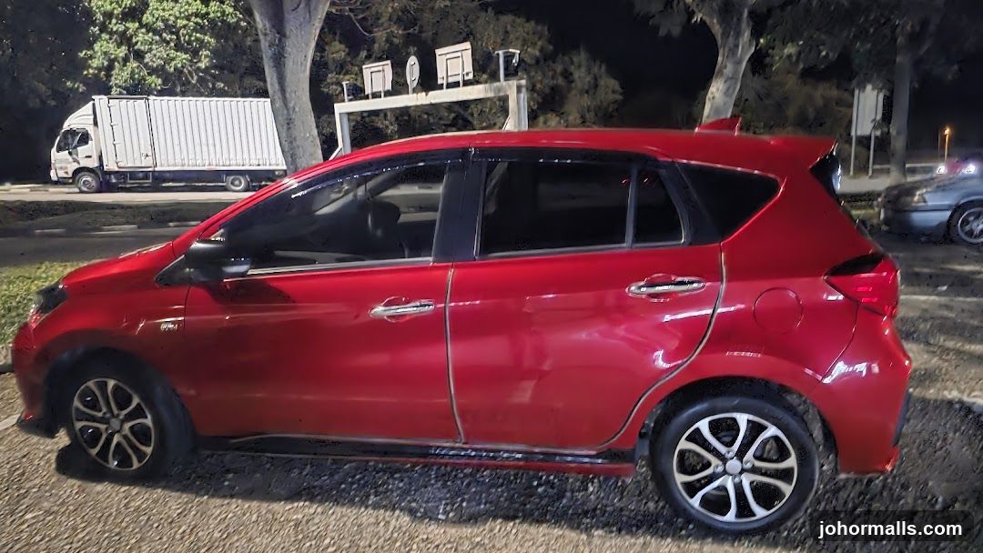 Red Car Parked at Night