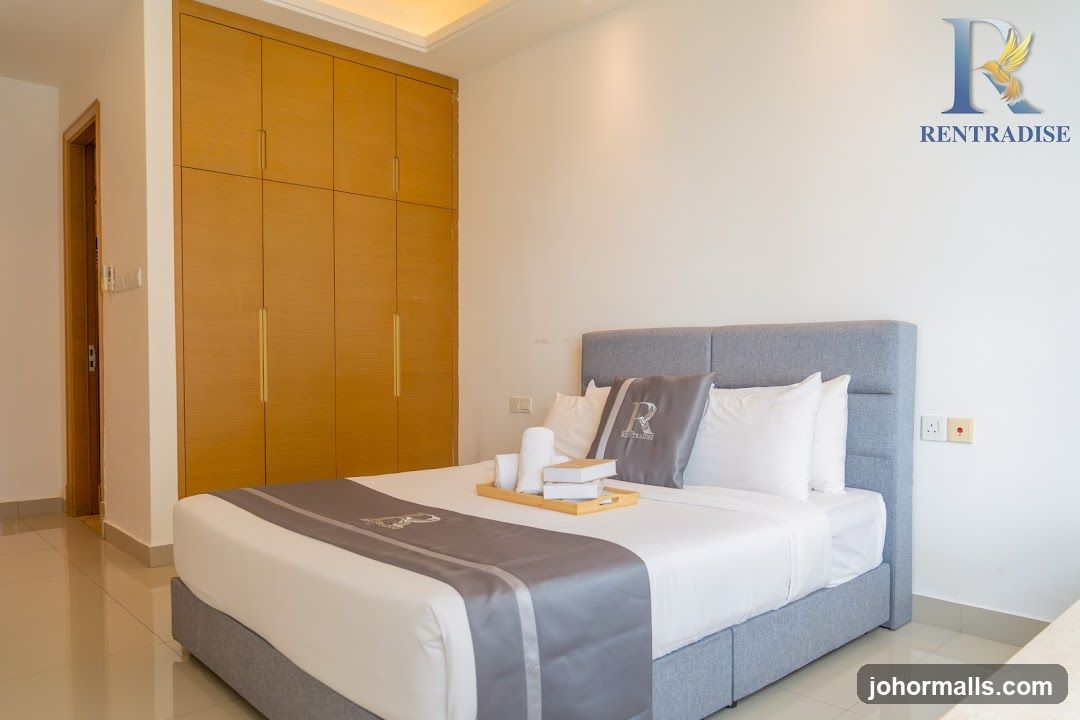 Bedroom with a large bed and built-in wardrobe
