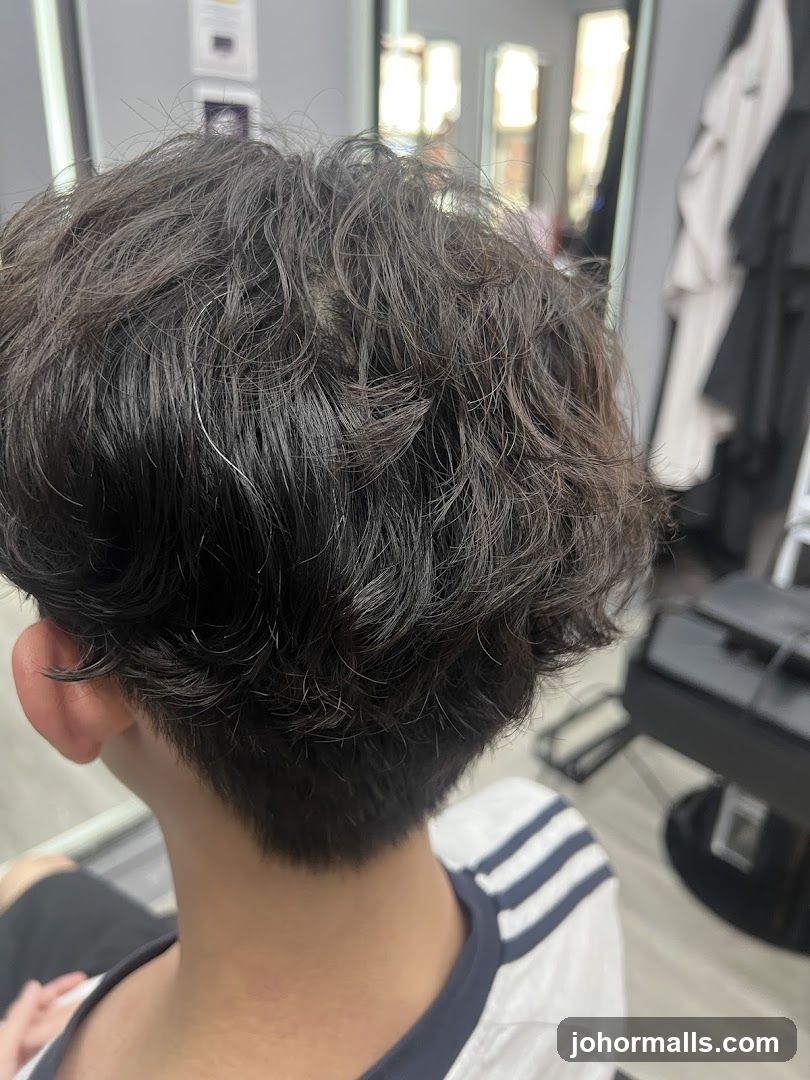 Close-up of a person's haircut