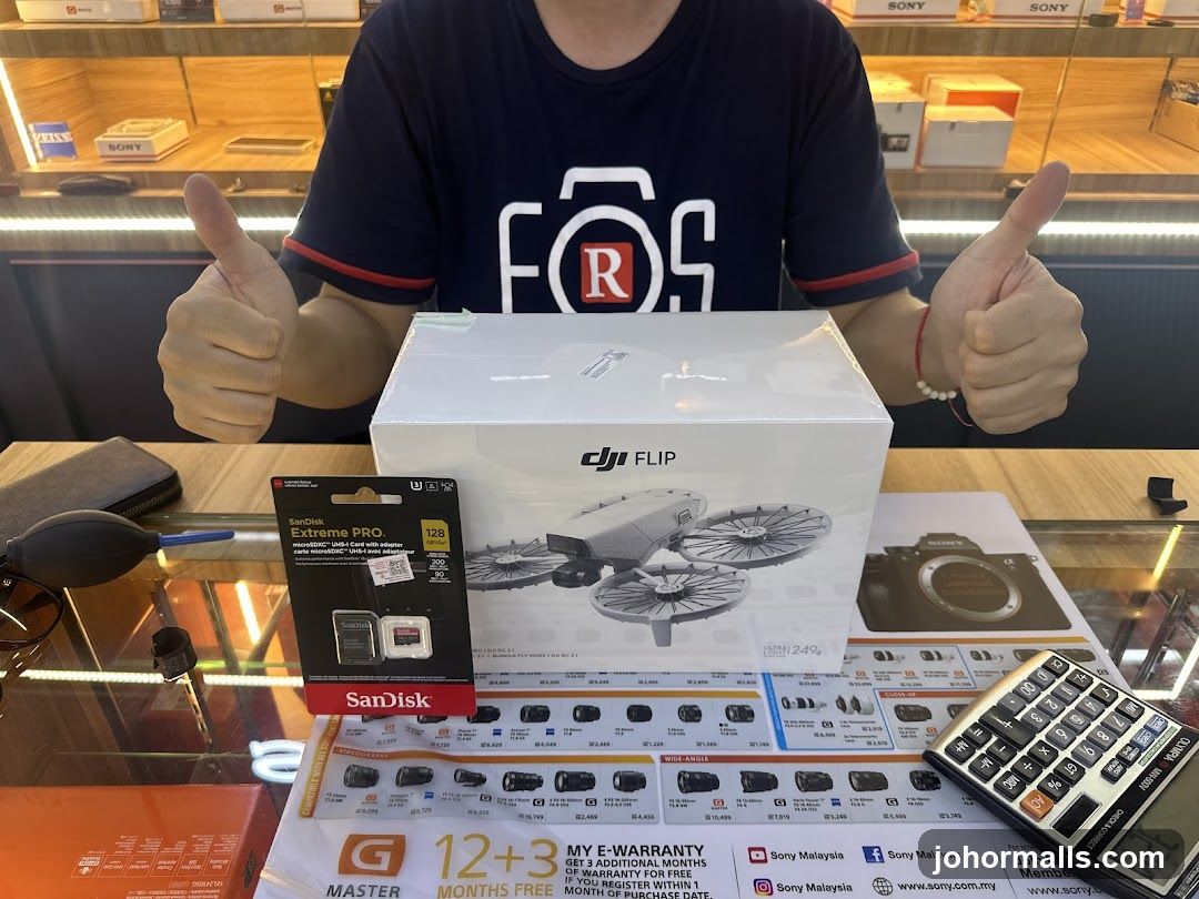 Person showing off a new drone and accessories