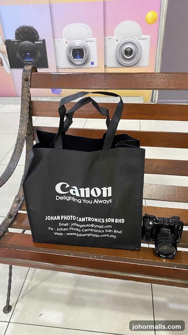 Canon branded tote bag and camera
