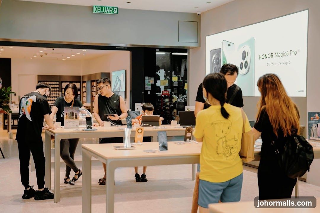 Customers browsing electronics in a store
