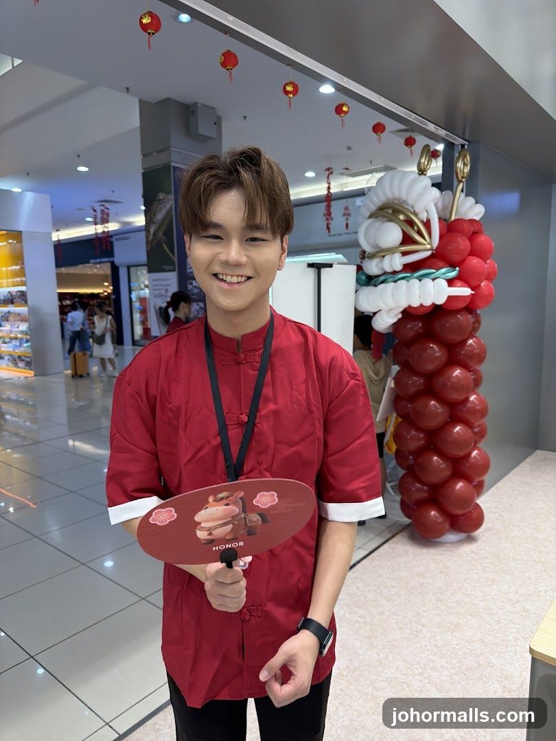 Man in Red Holding a Fan