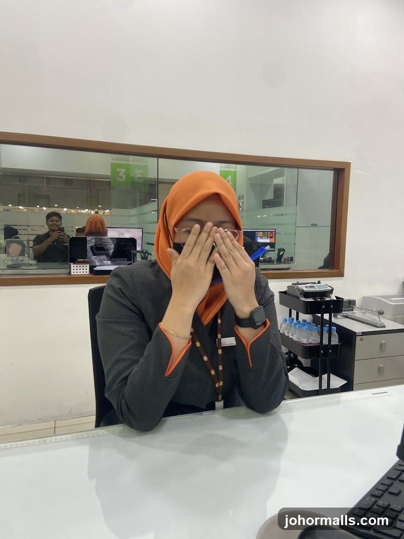 Woman in hijab at a desk