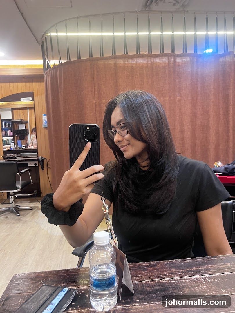 Woman taking a selfie in a salon
