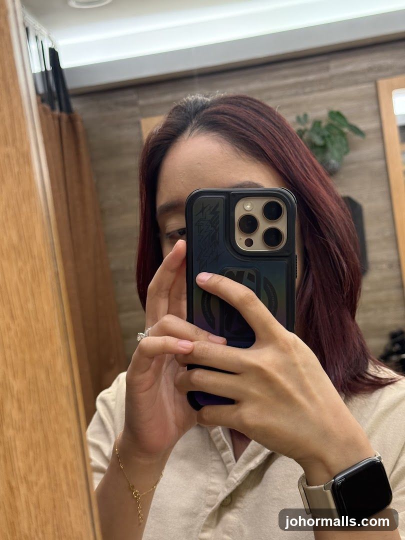 Woman taking a mirror selfie