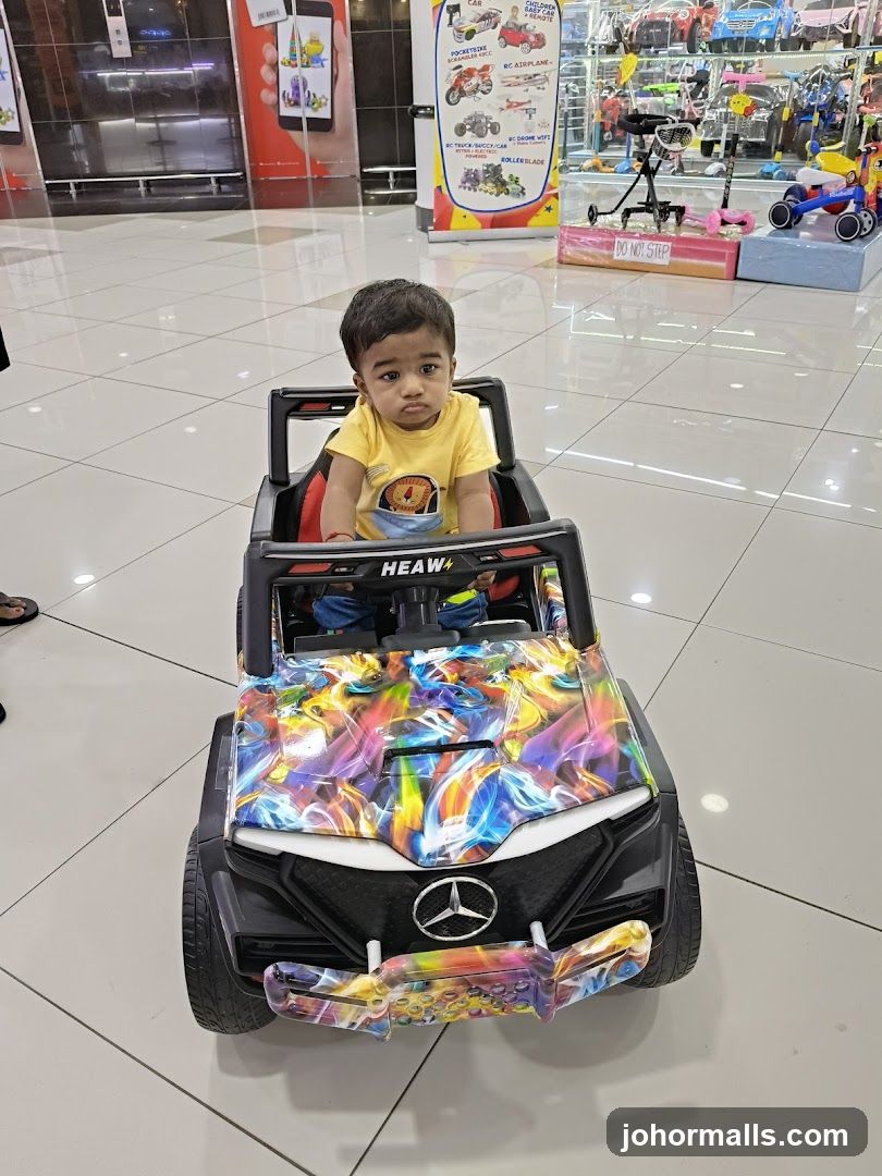 Child in toy car