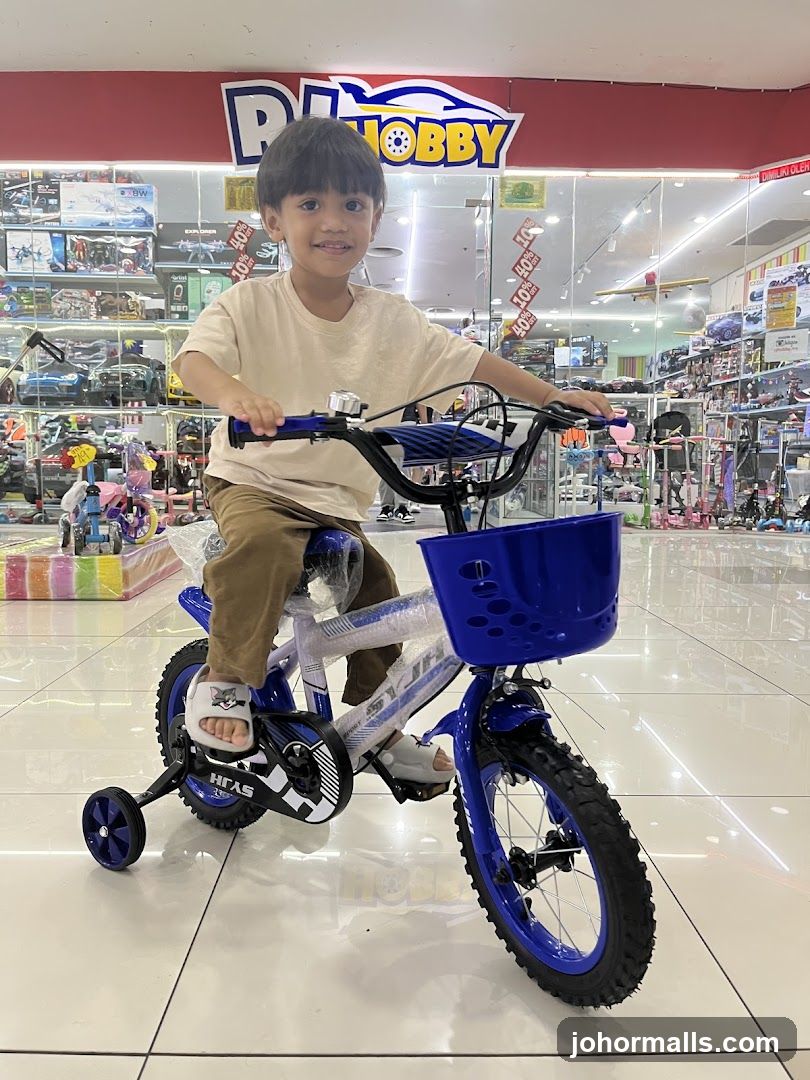 Boy on a blue bicycle in a toy store