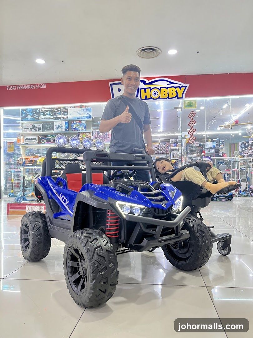Man and child with toy UTV