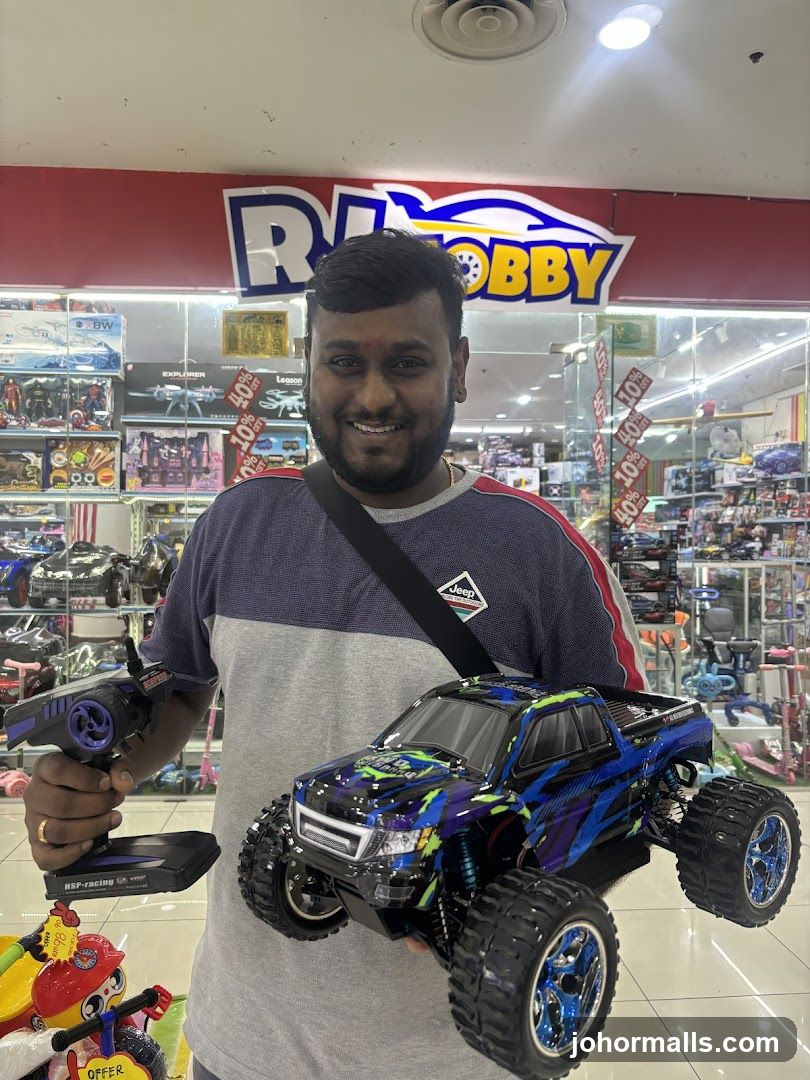 Man holding a remote-controlled car