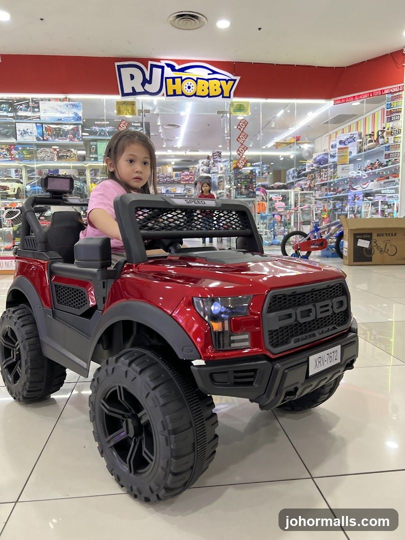 Child in a toy car