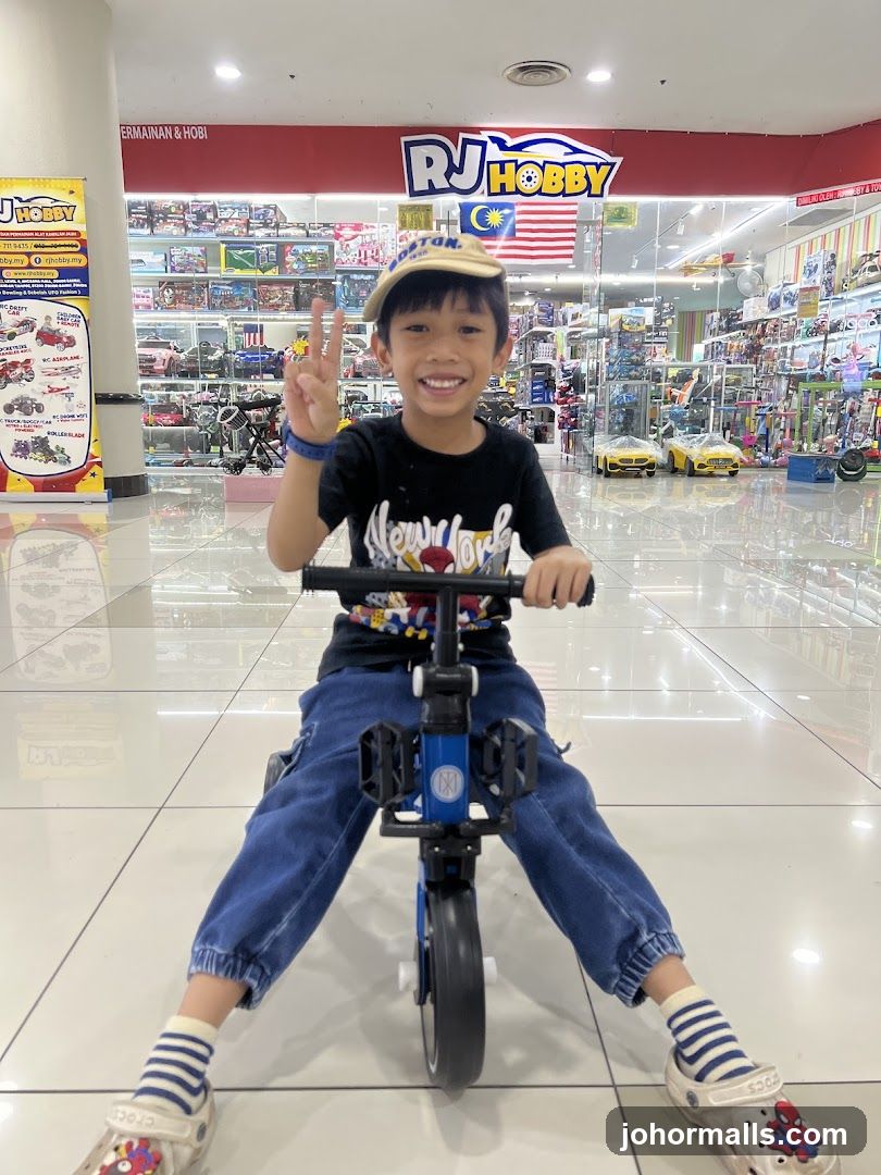 Boy on a tricycle in a toy store
