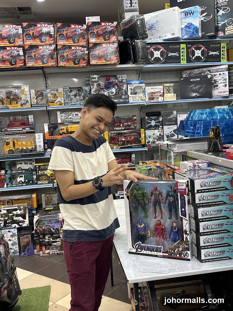 Man with Avengers Action Figures