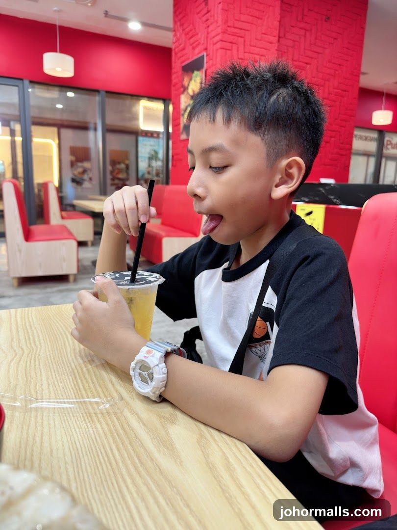 Boy drinking a beverage