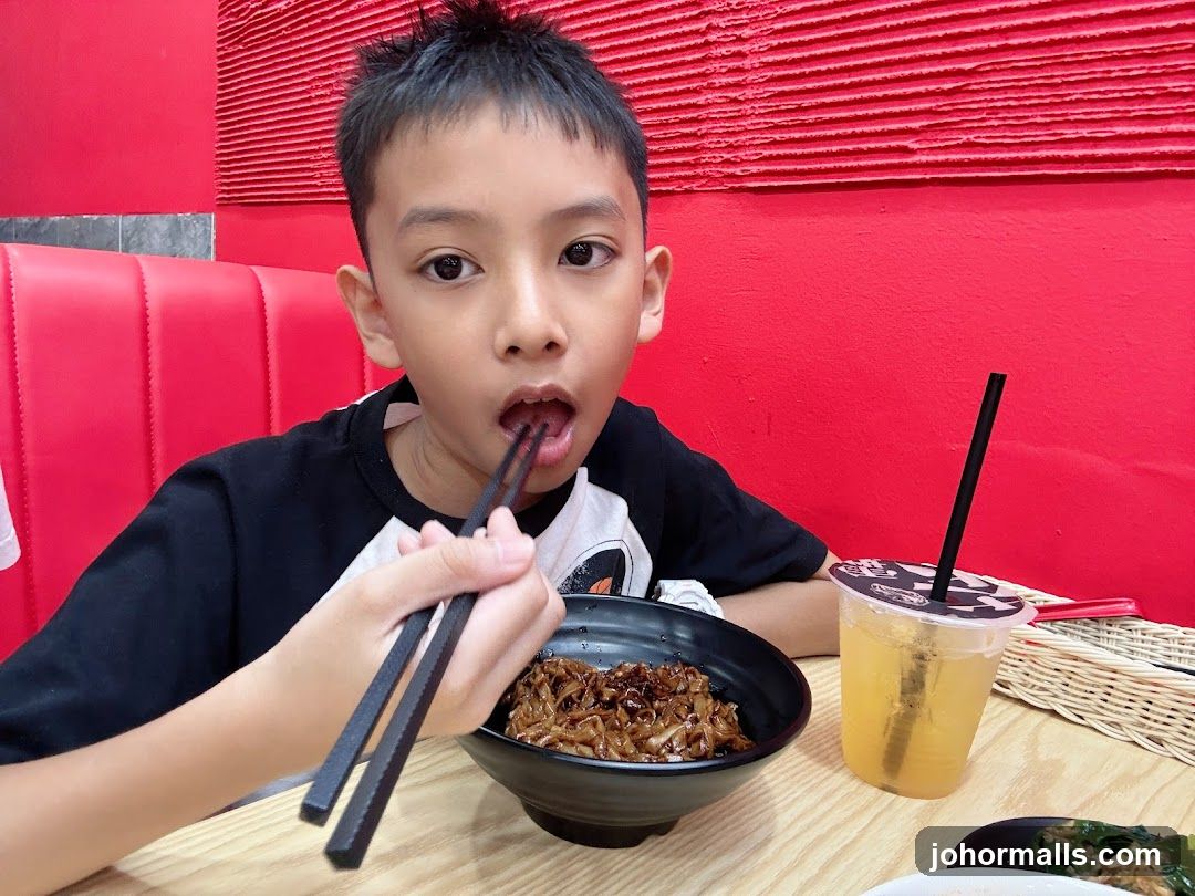 Boy eating noodles