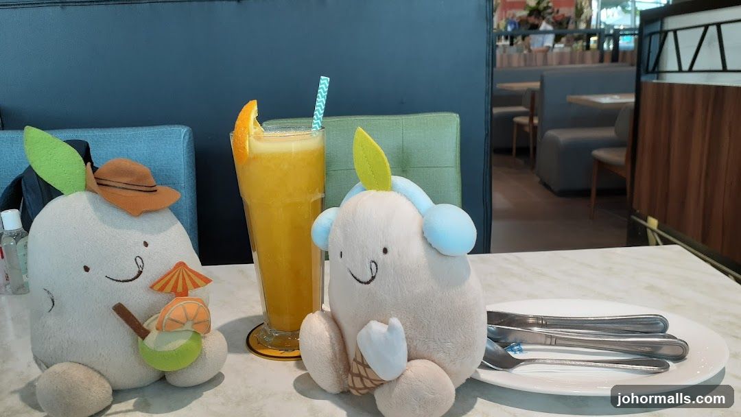 Plush toys with orange juice and cutlery