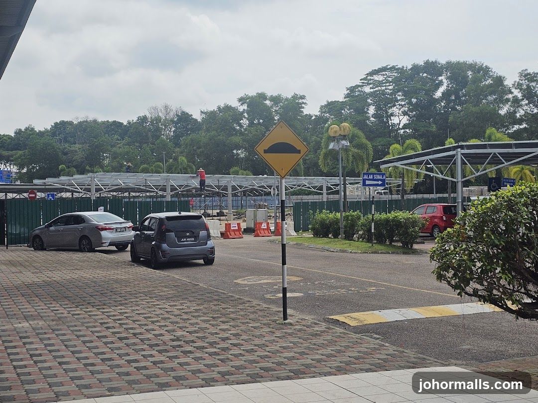 Construction site with cars and signage