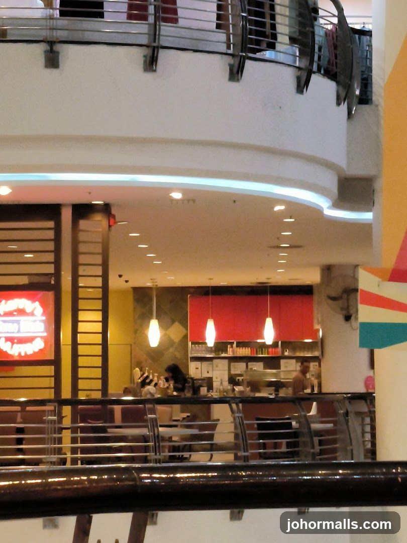 Interior of a restaurant with a neon sign