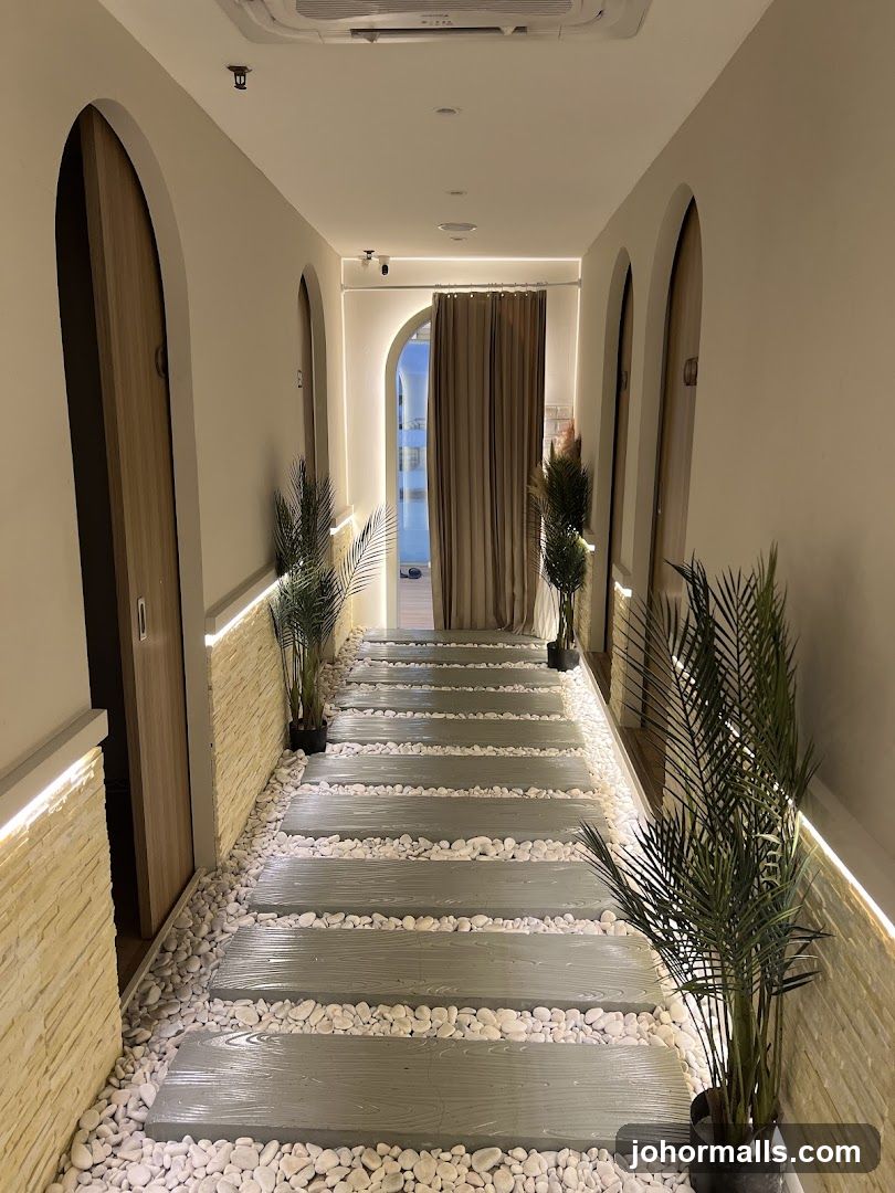 Indoor walkway with decorative flooring and plants