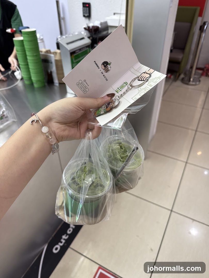 Two green drinks and merchandise