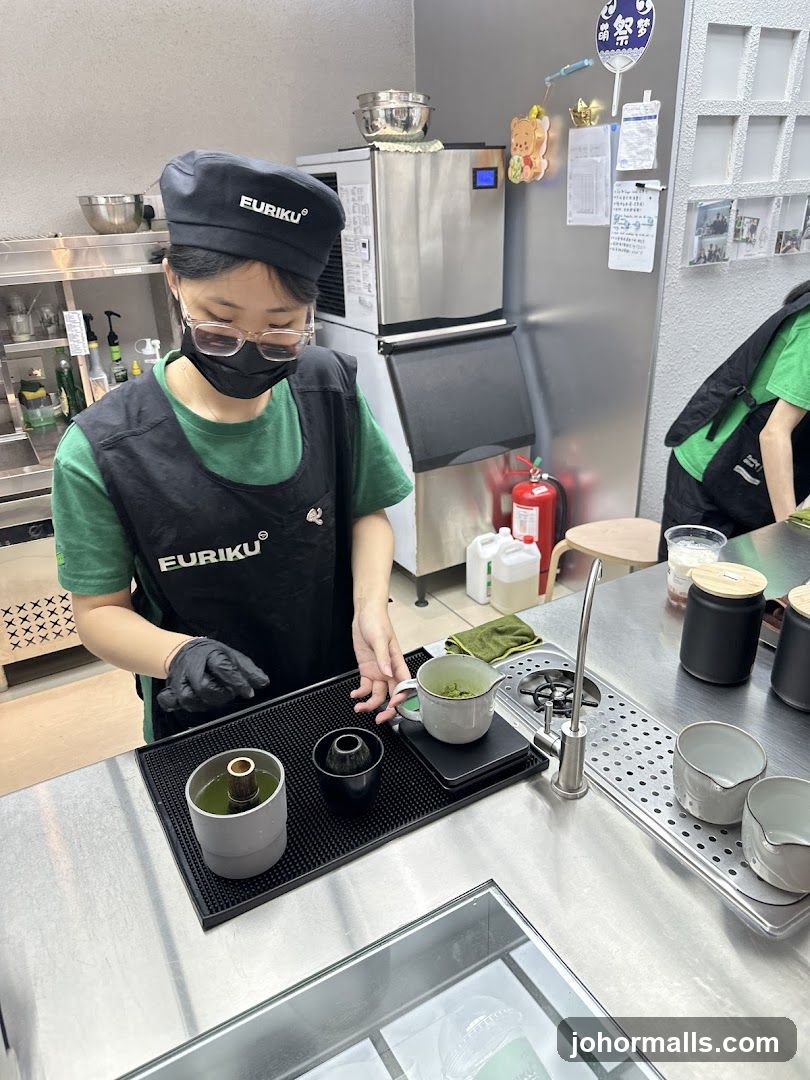 Barista preparing matcha
