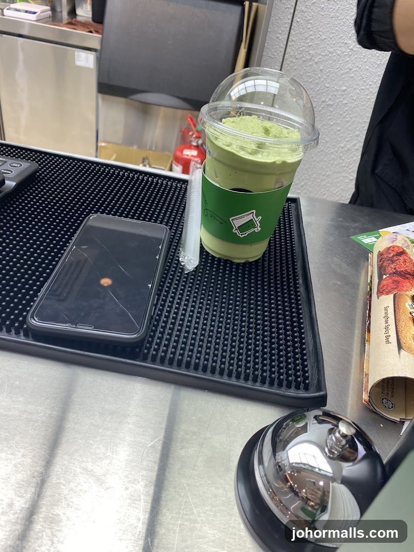 Matcha Drink and Phone on Counter