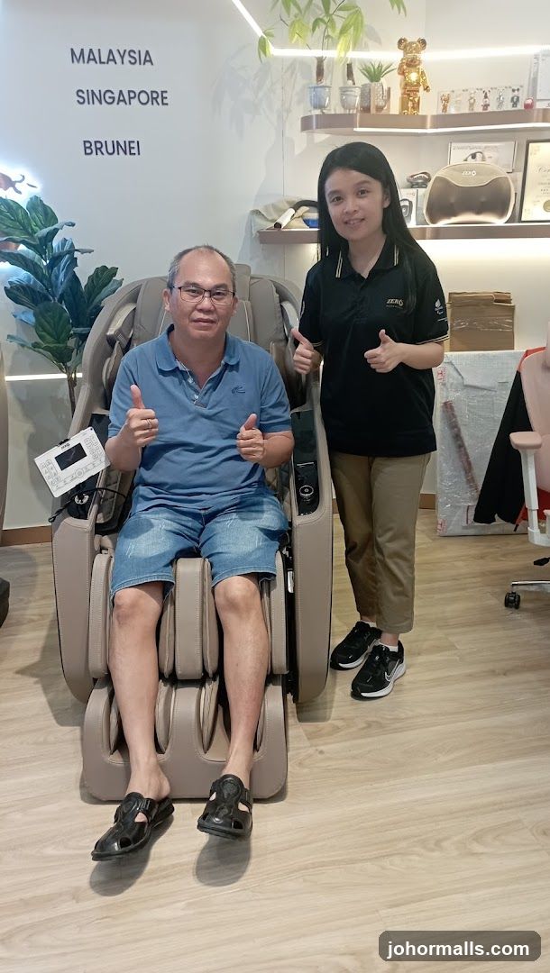 Customer and staff in a massage chair showroom