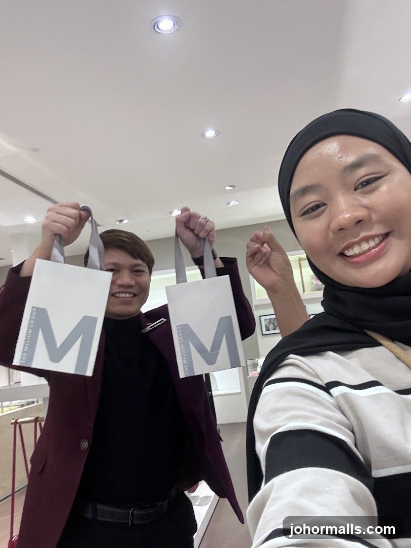 Two people holding shopping bags