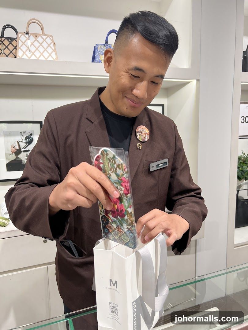 Sales associate packing a purchase