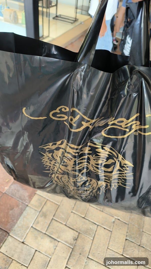 Black shopping bag with gold tiger graphic