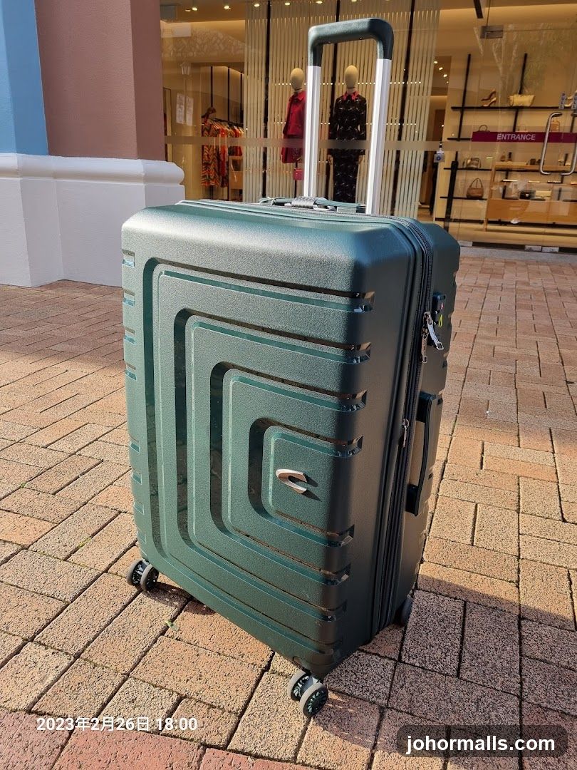 Green Suitcase Outside Store
