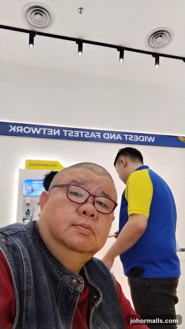 Man in Glasses and Store Interior