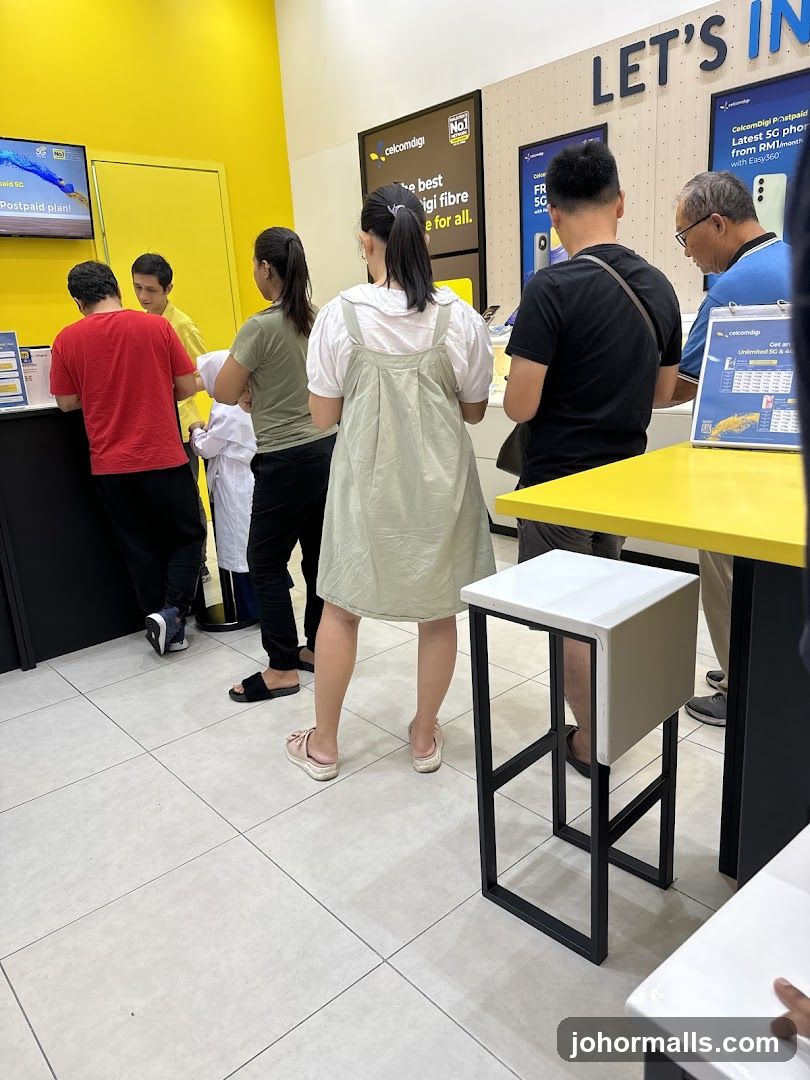 Customers in a Celcom Digi store