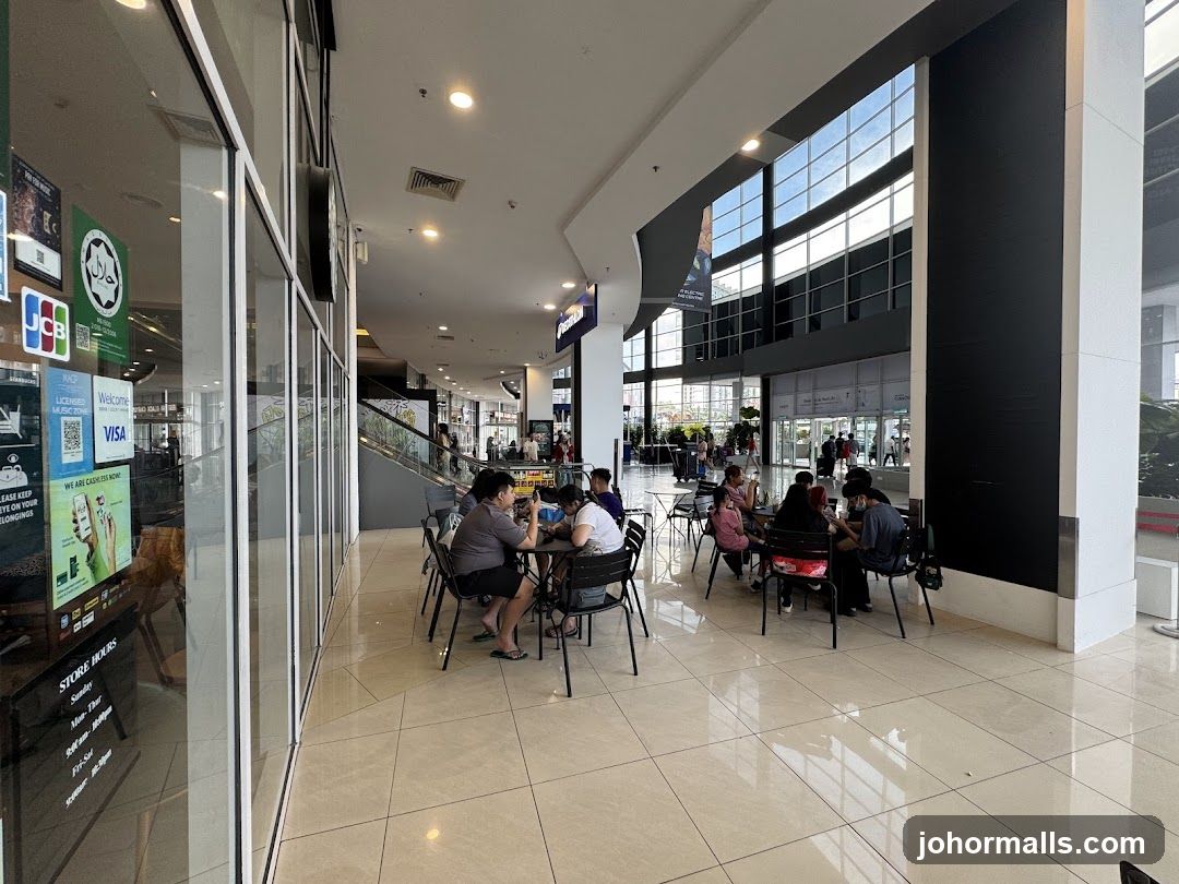 People sitting at tables in a mall