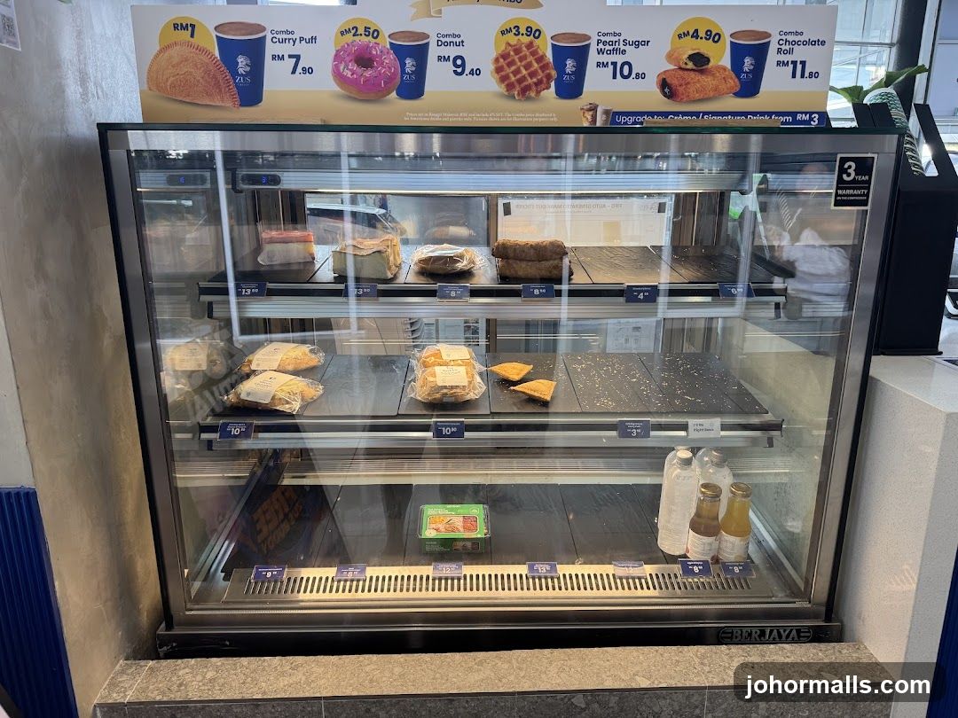 Display Case with Pastries and Drinks