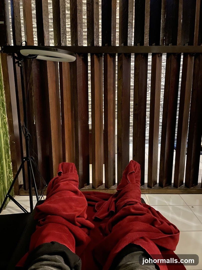 Feet wrapped in red towels