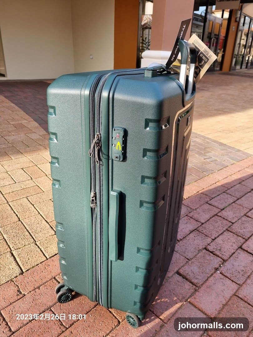 Green Suitcase with Tags