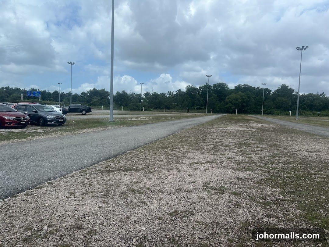 Parking Lot with Trees and Cloudy Sky