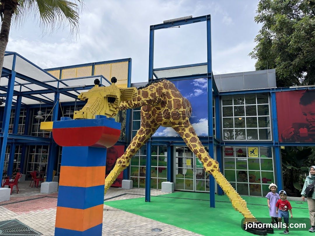 Lego Giraffe Sculpture at Building Entrance