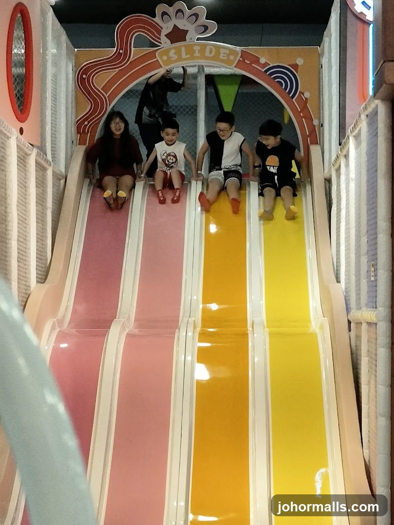 Children on a colorful slide
