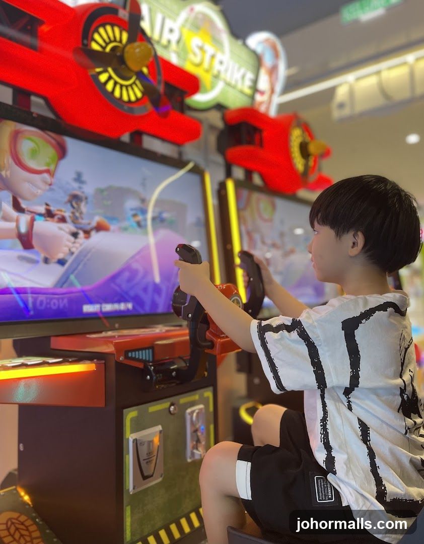 Boy Playing Arcade Game