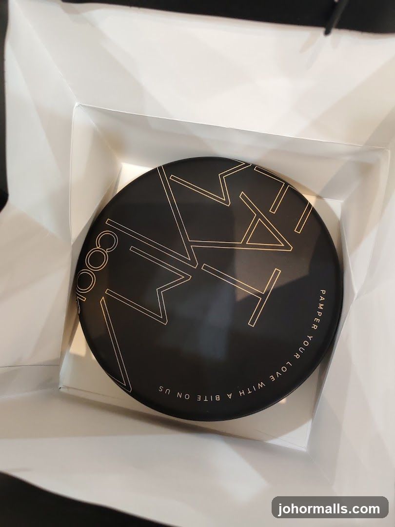 Round Black Container with Gold Geometric Design