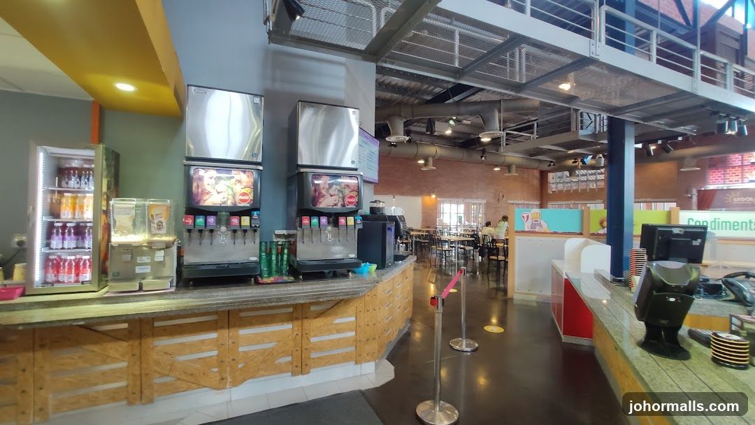 Restaurant Interior with Drink Dispensers and Seating Area