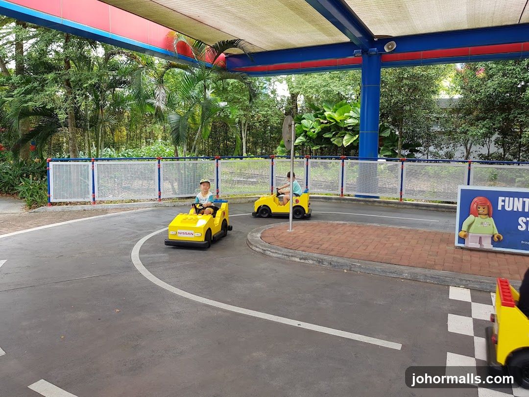 Children driving toy cars