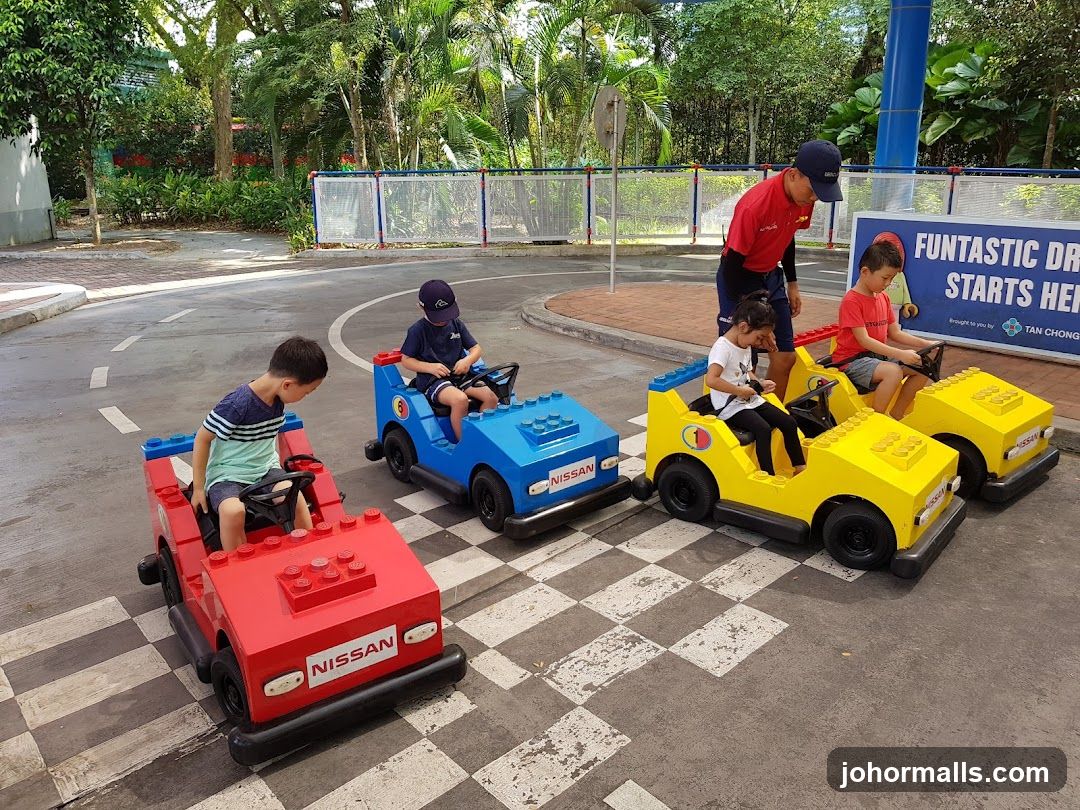 Children driving toy cars
