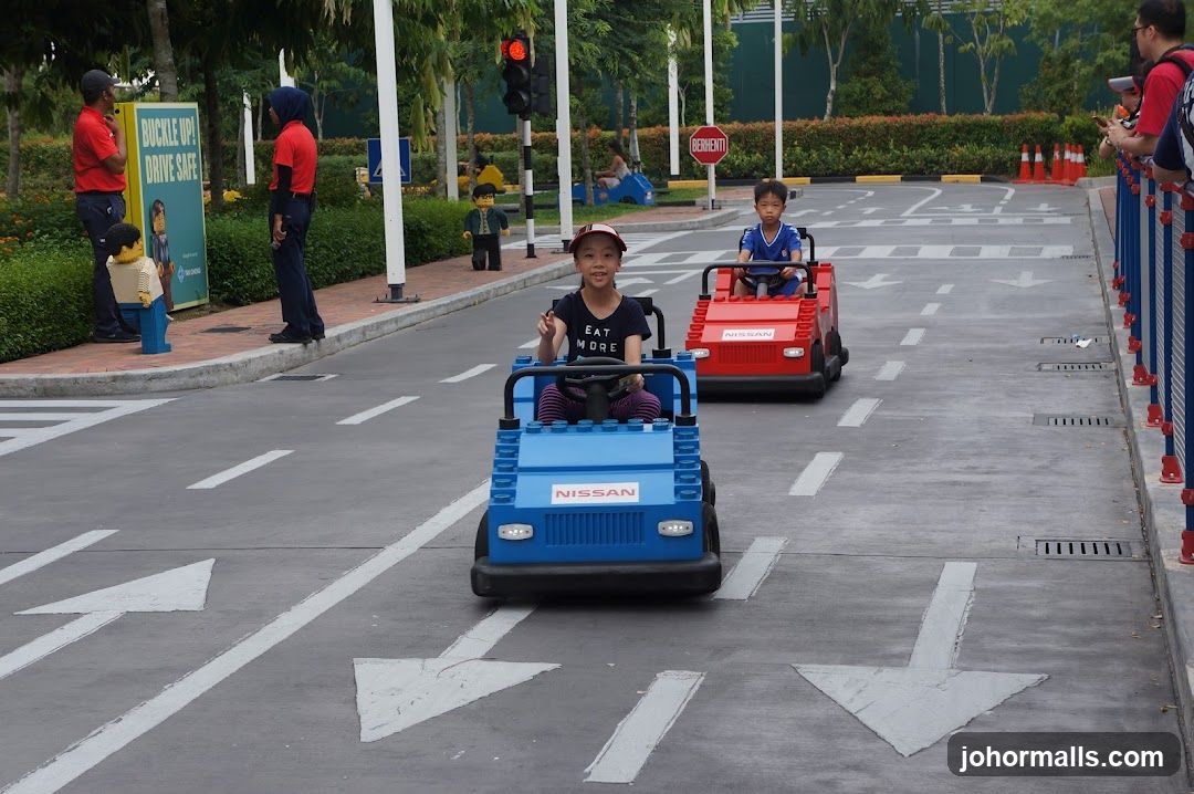 Children driving toy cars