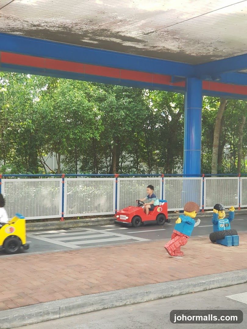 Children Driving Lego Cars